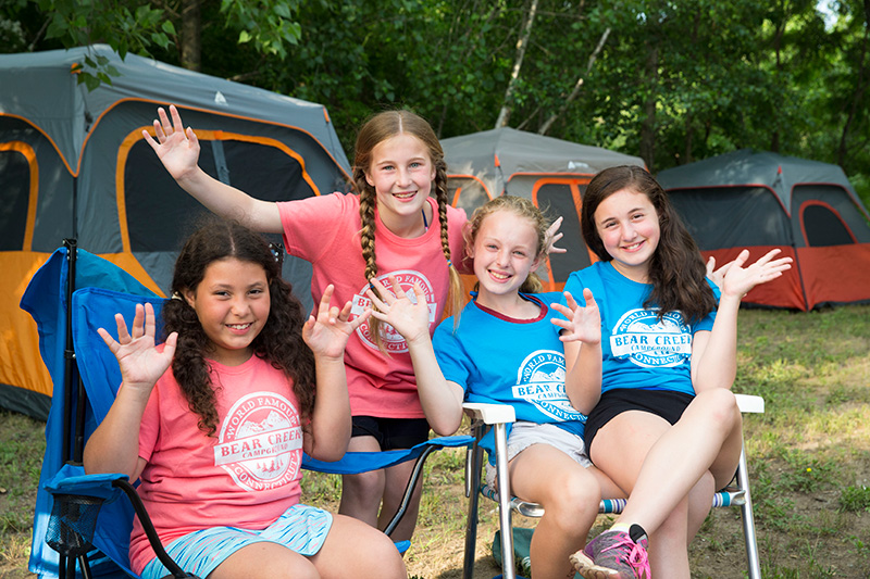 Girls having fun camping