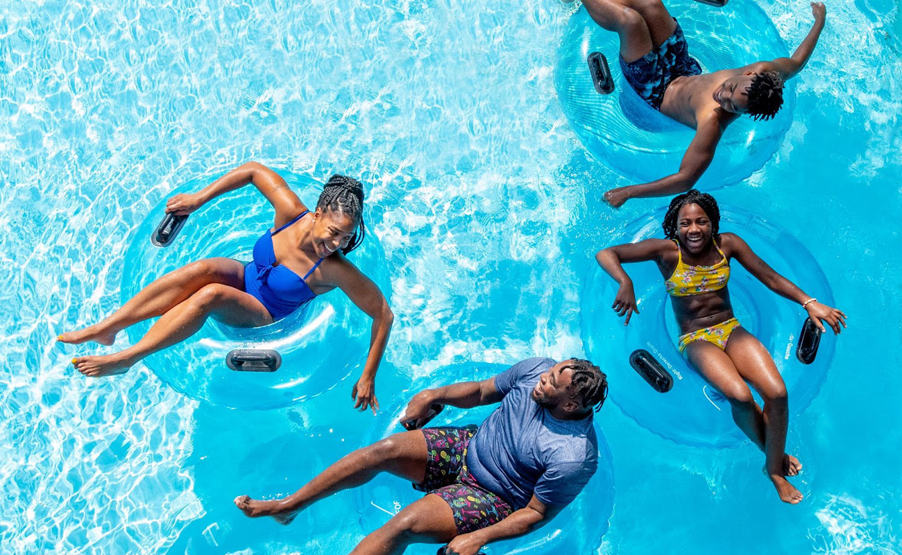 Family having fun on innertubes in the water