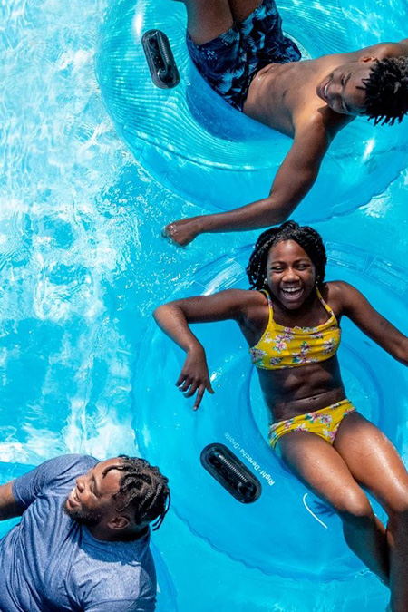 Family having fun on innertubes in the water