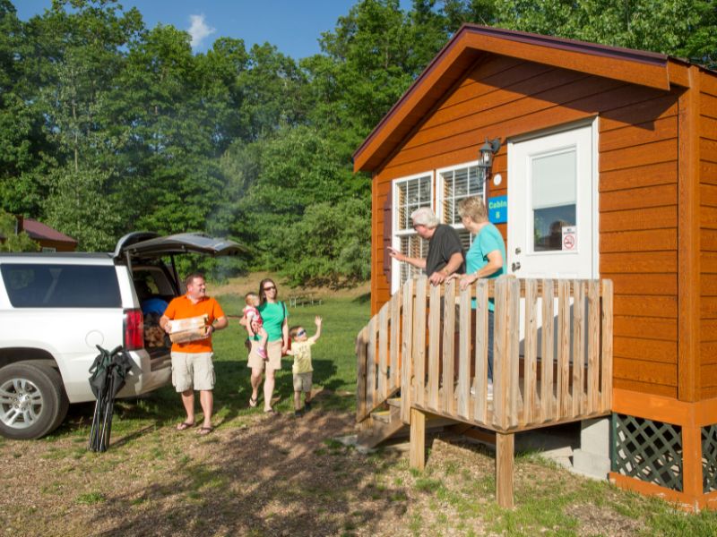 Family arriving at cabin
