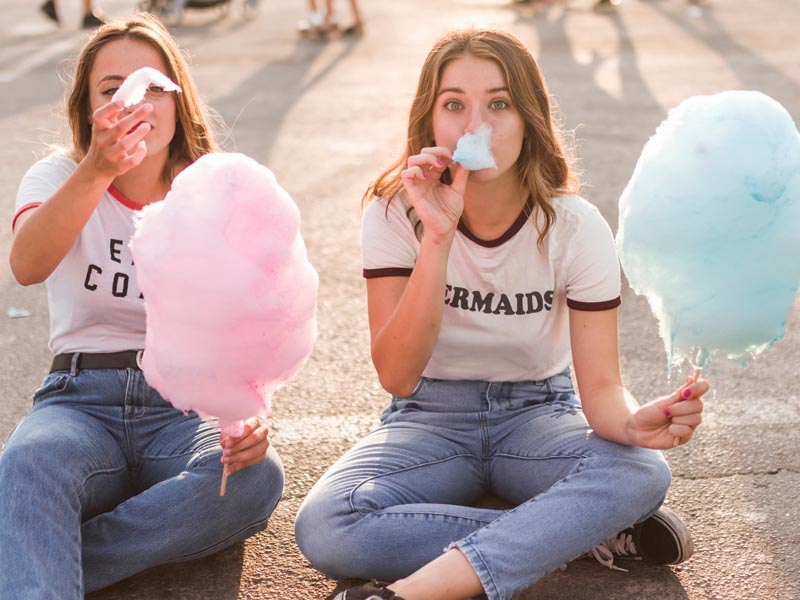 Girls eating cotton candy