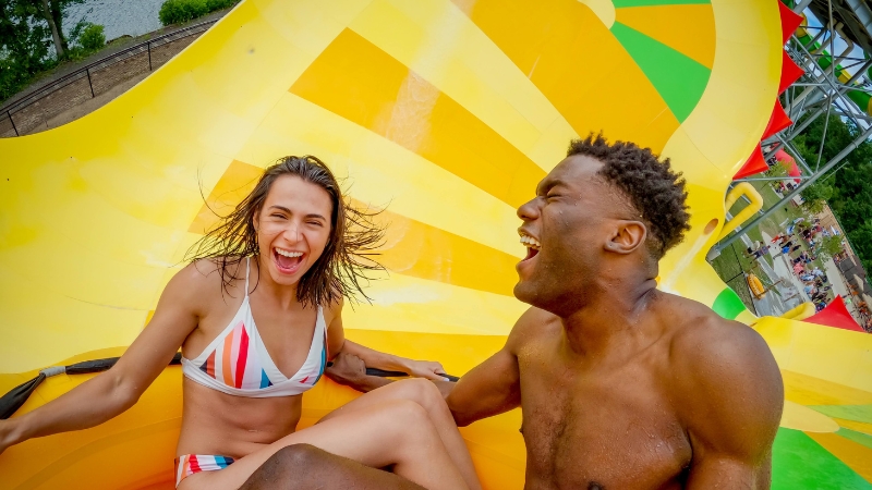 Couple enjoying water slide